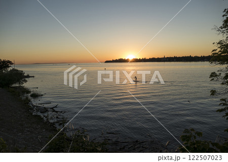 Sunset at lake Bodensee, Lindau Harbour, in Bavaria, Germany 122507023