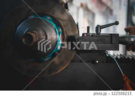 Checking car brake system for repair at car garage 122508215
