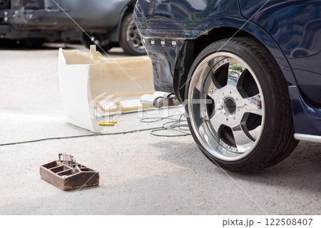 Checking car body work fiber bumper at car garage Checking car body work fiber bumper at car garage 122508407