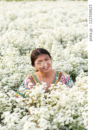 Woman (LGBTQ) posing at flower park garden field Woman (LGBTQ) posing at flower park garden field 122508625