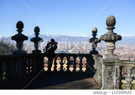 A tourist take a photo of Turin city from Villa della Regina A tourist take a photo of Turin city from Villa della Regina 122509420