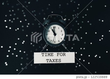 Black and white photo of a clock with the words Time for Taxes 122510889