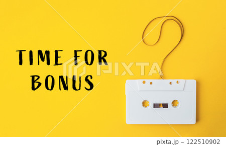 White cassette tape with a yellow background 122510902