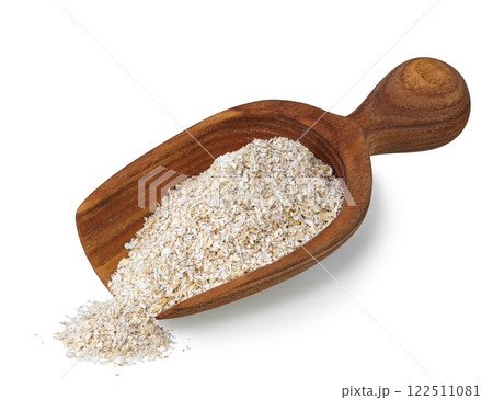 bran in wooden scoop isolated on white 122511081
