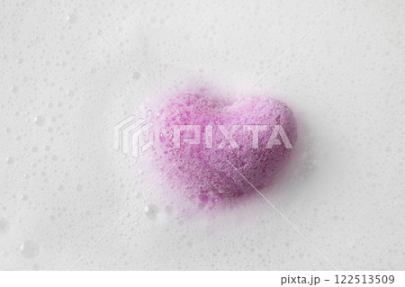 Valentine's Day heart shaped bathtub salt in white foam as background. View from above. Love concept. Romantic day spa. Valentine's Day heart shaped bathtub salt in white foam as background. View from above. Love concept. Romantic day spa. 122513509