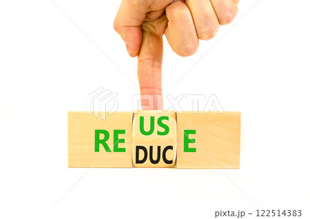 Reuse or reduce symbol. Concept words Reuse Reduce on wooden block. Beautiful white table white background. Businessman hand. Business reuse or reduce concept. Copy space. Reuse or reduce symbol. Concept words Reuse Reduce on wooden block. Beautiful white table white background. Businessman hand. Business reuse or reduce concept. Copy space. 122514383