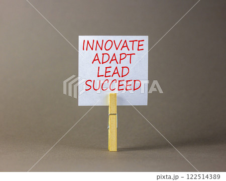 Innovate adapt lead succeed symbol. Concept words Innovate Adapt Lead Succeed on beautiful white paper. Beautiful grey background. Business innovate adapt lead succeed concept. Copy space. 122514389