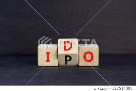 Initial public or DEX offering symbol. Concept words abbreviation IPO or IDO on wooden block. Beautiful black table black background. Business Initial public or DEX offering concept. Copy space. 122514399