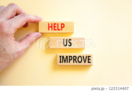 Help us improve symbol. Concept words Help us improve on beautiful wooden blocks. Beautiful white background. Businessman hand. Business motivational help us improve concept. Copy space. Help us improve symbol. Concept words Help us improve on beautiful wooden blocks. Beautiful white background. Businessman hand. Business motivational help us improve concept. Copy space. 122514407