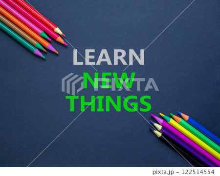 Learn new things symbol. Concept words Learn new things on beautiful grey paper. Beautiful grey paper background. Colored pencils. Business motivational learn new things concept. Copy space. 122514554