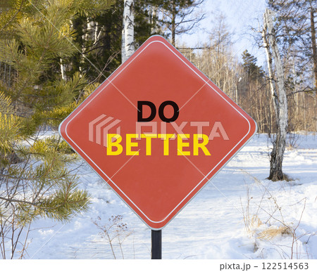 Do better symbol. Concept words Do better on beautiful red road sign. Beautiful winter forest background. Business and do better concept. Copy space. 122514563