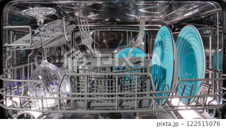 Open dishwasher with clean dishes Housekeeping concept Open dishwasher with clean dishes Housekeeping concept 122515076