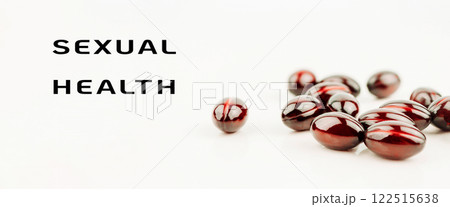 Bunch of red pills with the words sexual health written below them Bunch of red pills with the words sexual health written below them 122515638