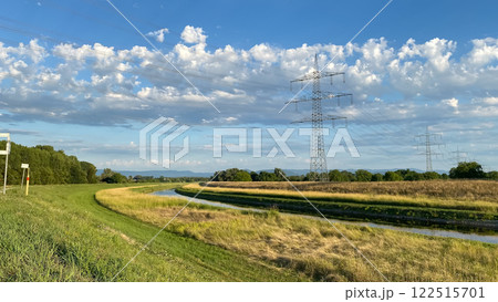 Field with a power line running through it Field with a power line running through it 122515701
