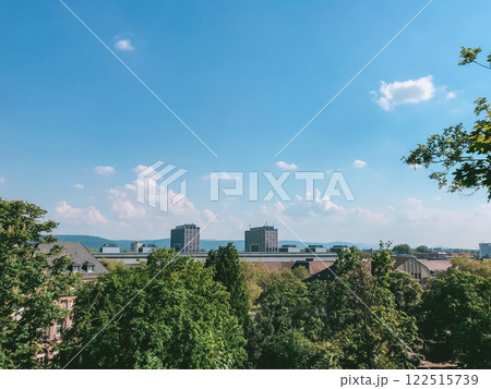 City skyline with a clear blue sky and a few clouds City skyline with a clear blue sky and a few clouds 122515739