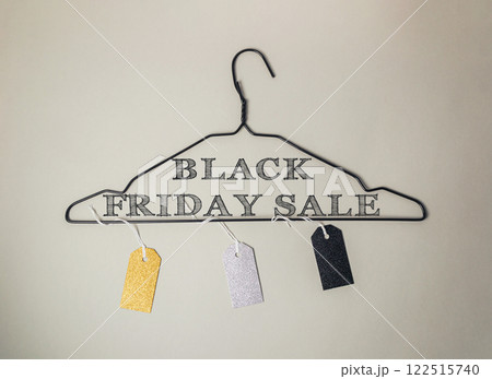 Black Friday sale sign is hanging on a clothes hanger 122515740