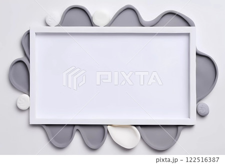 An empty rectangular frame is surrounded by an abstract arrangement of gray and white shapes on a gray background, ideal for showcasing artwork or text. Generative AI 122516387