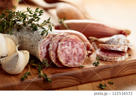 Dry-cured sausage with thyme, garlic, and onion. Dry-cured sausage with thyme, garlic, and onion. 122516572