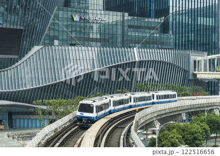 A train on the Wenhu or Brown Line of the Taipei MRT, Taiwan passes by the Nangang CTBC Financial Holding building background. A train on the Wenhu or Brown Line of the Taipei MRT, Taiwan passes by the Nangang CTBC Financial Holding building background. 122516656