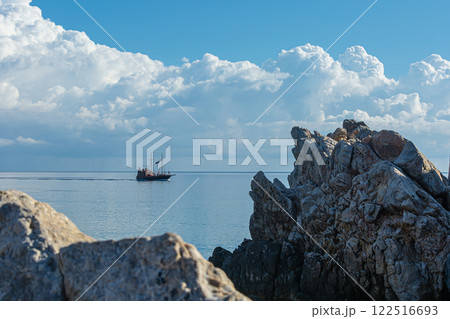 Greece, Crete-09/29/2015: Tourist boat on the background of the horizon and Cumulus clouds 122516693