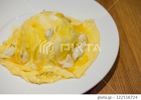 Omelette with crab served on plate 122516724