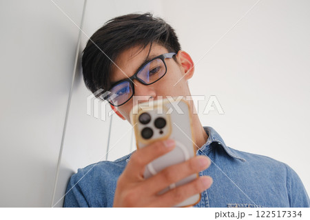 Young architect sketching house plans on a work desk in a modern office 122517334
