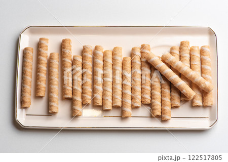 Crunchy Rolled Wafer Sticks on Elegant Tray 122517805