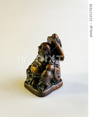 Figurine of a funny, laughing and cheerful golden copper Buddha or Hotei. Concept of luck, prosperity and Chinese god of wealth Figurine of a funny, laughing and cheerful golden copper Buddha or Hotei. Concept of luck, prosperity and Chinese god of wealth 122517839
