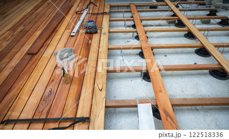 Wooden outside deck construction in progress Wooden outside deck construction in progress 122518336