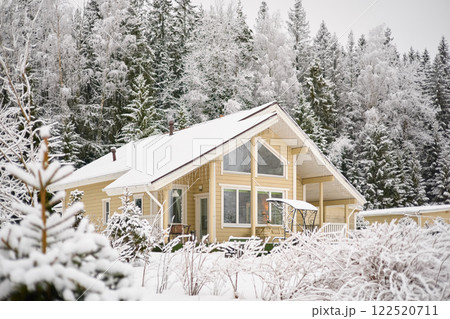 beautiful country house in a snowy pine forest, night lighting, winter fairy tale beautiful country house in a snowy pine forest, night lighting, winter fairy tale 122520711
