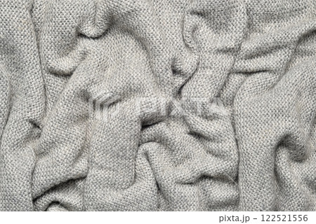Close up texture of light gray crumpled woven fabric with a subtle pattern of evenly spaced tiny dots, providing a soft, neutral background ideal for design and creative projects. Close up texture of light gray crumpled woven fabric with a subtle pattern of evenly spaced tiny dots, providing a soft, neutral background ideal for design and creative projects. 122521556