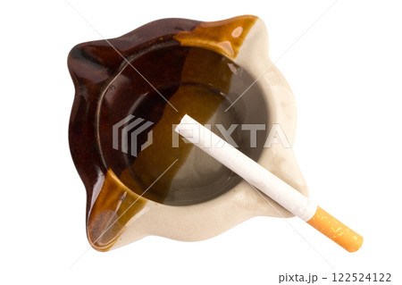 Ceramic ashtray with cigarette isolated on white background Ceramic ashtray with cigarette isolated on white background 122524122