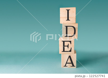 Stack of wooden blocks with the letters IDEA on top Stack of wooden blocks with the letters IDEA on top 122527741