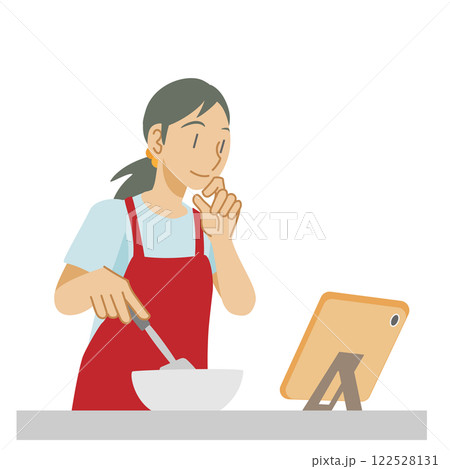 タブレットでレシピを確認しながら料理をする女性 122528131