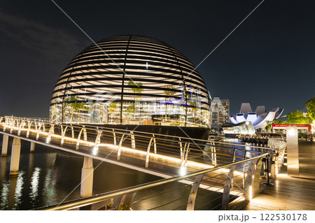 Night view of the Apple Marina Bay Sands with a skyscraper background, Singapore, is the first Apple store in the world surrounded by water. 122530178