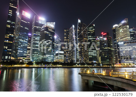 Night view of the Marina Bay Financial Centre and the Raffles Place modern office skyscrapers in Singapore.  122530179
