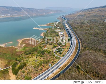 Drone shot aerial view landscape of the M6  motorway Expressway Nakhon Ratchasima Province - Bang Pa-in. Lam Ta Khong River and Mountain. Drone shot of scenic landscape rural place traffic. Nakhon 122530959