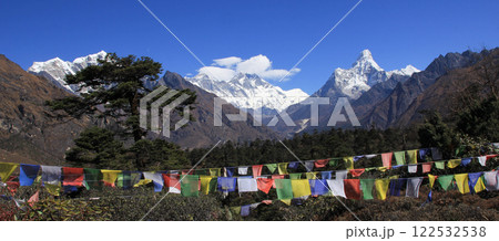 Prayer flags and Mount Everest, Lhotse and Ama Dablam, view from Khumjung, Nepal. Prayer flags and Mount Everest, Lhotse and Ama Dablam, view from Khumjung, Nepal. 122532538