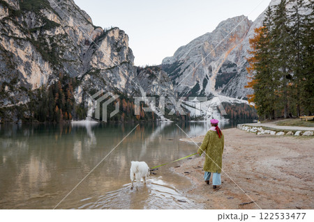 Woman and Dog at Lake in Dolomites Woman and Dog at Lake in Dolomites 122533477
