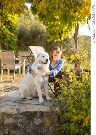 Woman in Rustic Garden 122533479