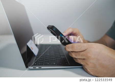 Close up male hands using smartphone shopping online, buying on internet. Close up male hands using smartphone shopping online, buying on internet. 122533549