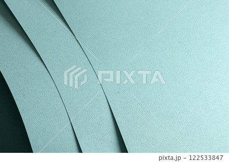 Blue paper texture with a punched, perforated pattern, featuring soft pastel tones and a matte Blue paper texture with a punched, perforated pattern, featuring soft pastel tones and a matte 122533847