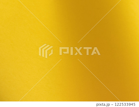 Lemon yellow paper background with a smooth matte surface and radiant, vivid tones. Bright, cheerful 122533945