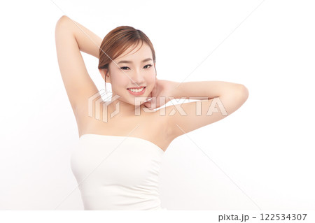 Beautiful Young Asian woman lifting hands up to show off clean and hygienic armpits or underarms on white background, Smooth armpit cleanliness and protection concept Beautiful Young Asian woman lifting hands up to show off clean and hygienic armpits or underarms on white background, Smooth armpit cleanliness and protection concept 122534307