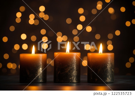 A close-up view of three burning candles set against an black background, evoking a celebration mood an embodiment of the festive concept with ample copy space. Created with generative AI tools 122535723