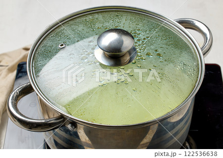 pot with a closed, dewy lid pot with a closed, dewy lid 122536638