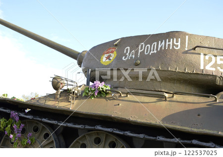 flowers near the tank at the memorial to those killed in the war flowers near the tank at the memorial to those killed in the war 122537025