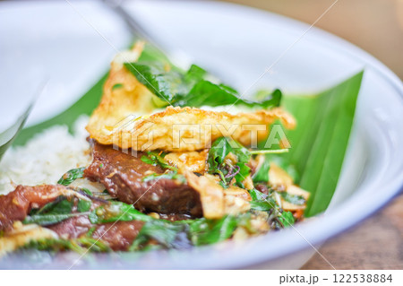Thai style holy Basil beef stir fry with fried egg. 122538884