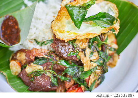 Thai style holy Basil beef stir fry with fried egg. 122538887