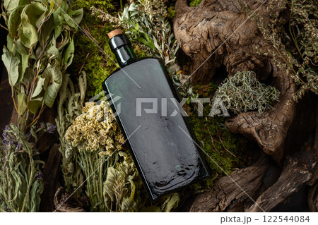Vintage bottles with tinctures and various dried herbs. Vintage bottles with tinctures and various dried herbs. 122544084